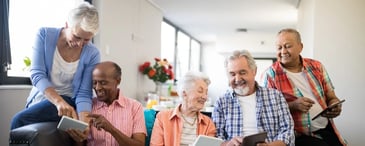 Elderly residents using tablets