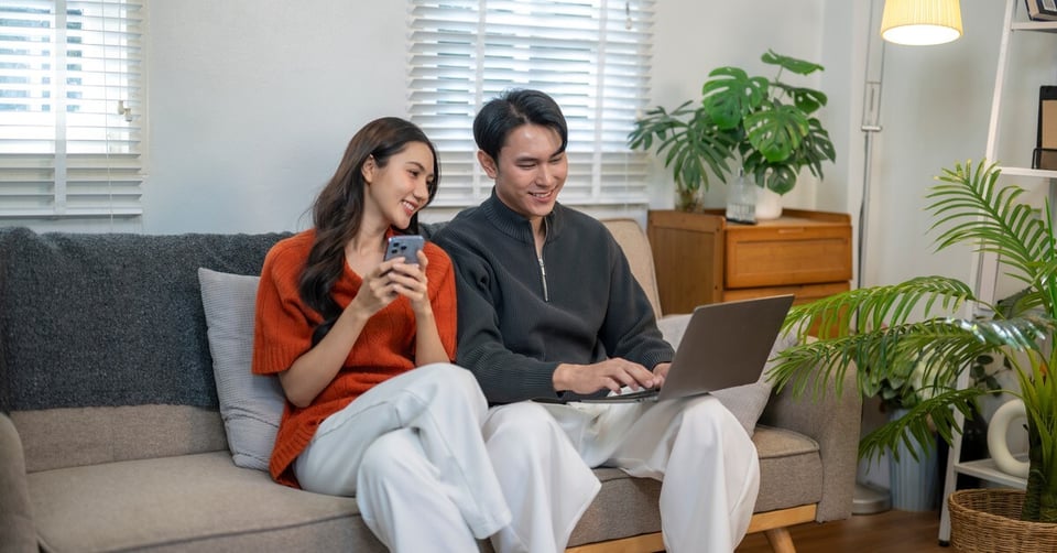 Residents using multiple devices in a modern apartment.